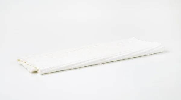 Folded white placemat — Stock Photo, Image