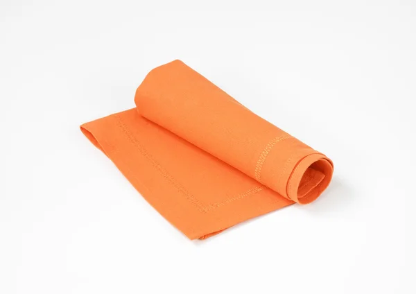 Gerollte orangefarbene Serviette — Stockfoto