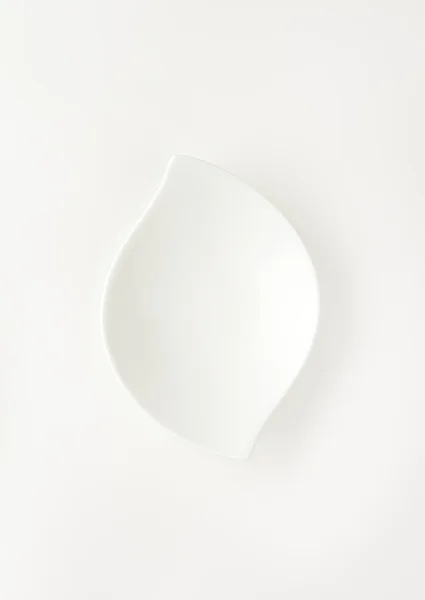 Böjda vit skål — Stockfoto