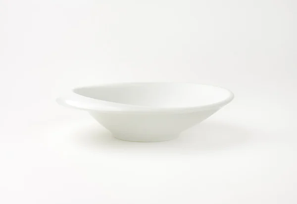 White bowl with irregular rim — Stock Photo, Image