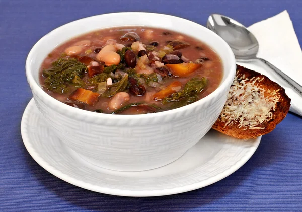 Kale, bean and vegetable soup close up. — Stock Image Kale, bean and vegetable soup close up. Royalty Free Stock Images