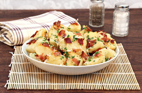 Roasted potatoes with bacon, parmesan and garlic.