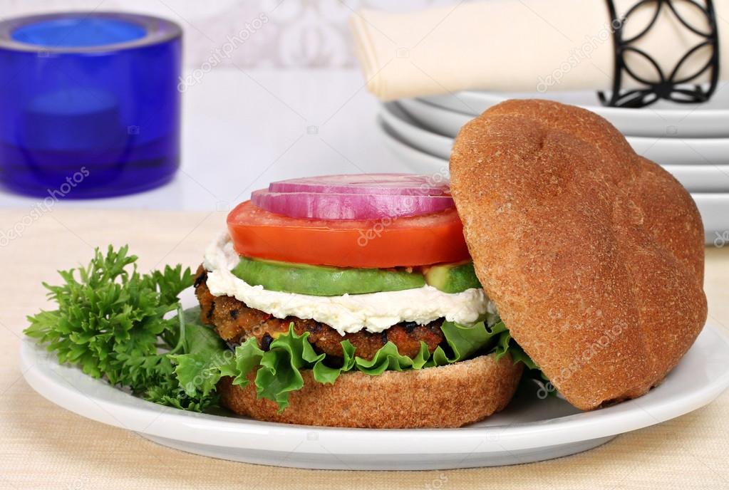 Vegetarian black bean burger on a whole wheat roll.