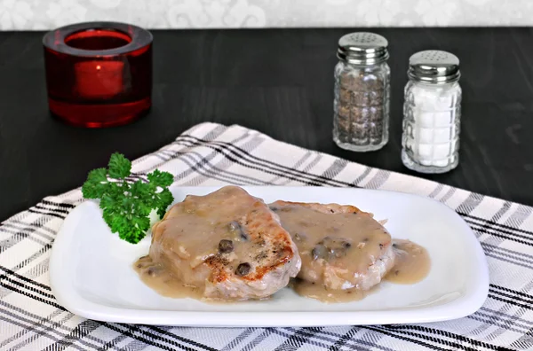 Baked pork chops with mushroom gravy. — Stock Photo, Image