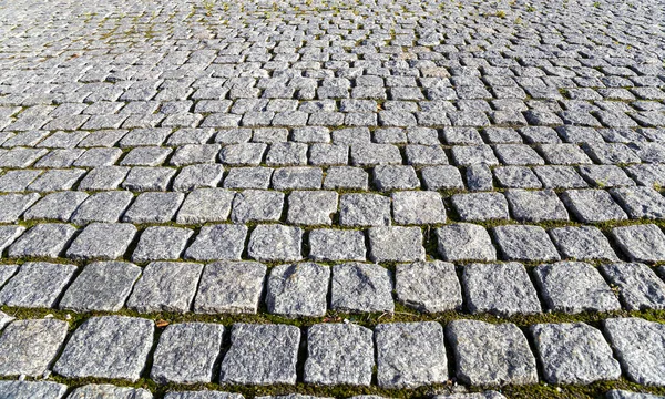 Yolun Eski Bir Granit Taşla Döşenmiş Parçası Arkaplan Olarak Kullanılabilir — Stok fotoğraf