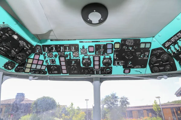 The cockpit of a Russian helicopter with control devices (the names of the devices are written in Russian)