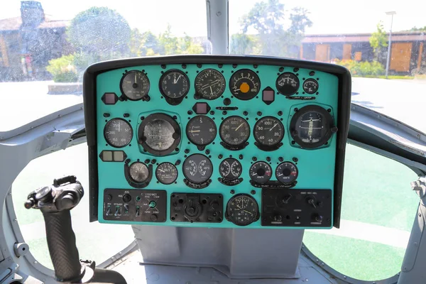 The cockpit of a Russian helicopter with control devices (the names of the devices are written in Russian)