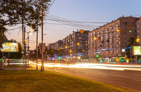 MOSCOW, RUSSIA- JUNE 20, 2021: Traffic cars on one of the streets in Moscow (summer evening)