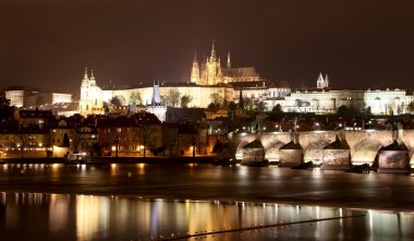 Vltava river, Charles Bridge (Stone Bridge, Prague Bridge)  and St. Vitus Cathedral at night. Prague. Czech Republic clipart