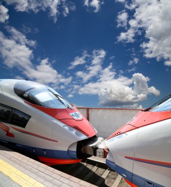 MOSCOW, RUSSIA - JUNE, 03 2015-- Aeroexpress Train Sapsan against the sky-- high-speed train acquired OAO Russian Railways for use on the Russian high-speed railways
