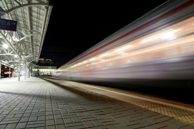 Train on Moscow passenger platform at night (Belorussky railway station) is one of the nine main railway stations in Moscow, Russia.