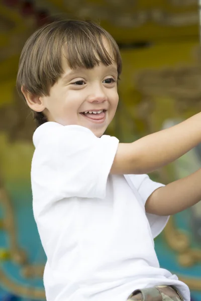 Happy boy having fun riding — Stock Photo, Image