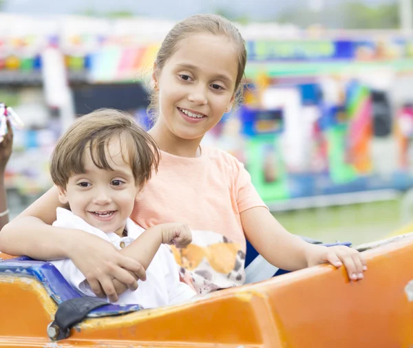 Happy children having fun riding — Stock Photo, Image