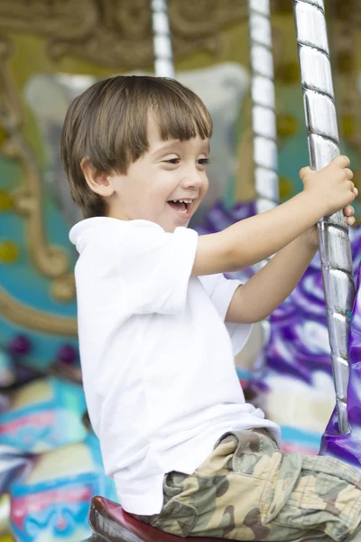 Happy boy having fun riding — Stock Photo, Image