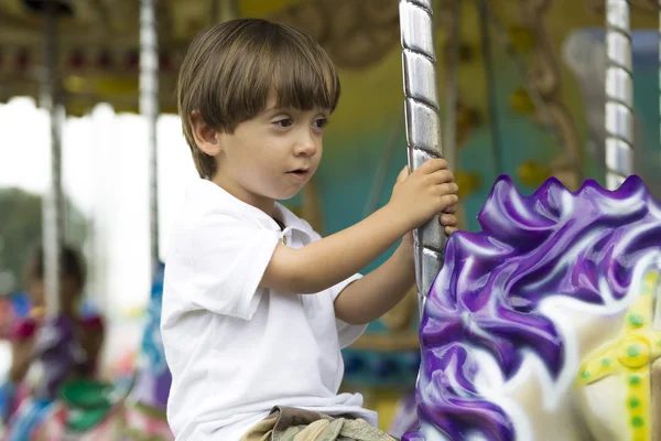 Happy boy having fun riding — Stock Photo, Image