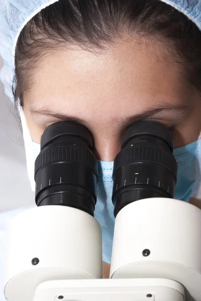 At the microscope — Stock Photo, Image