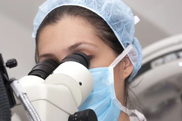 At the microscope — Stock Photo, Image