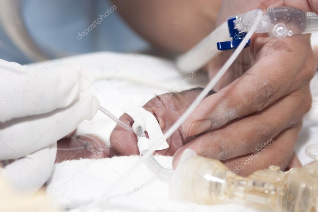 Newborn and hand