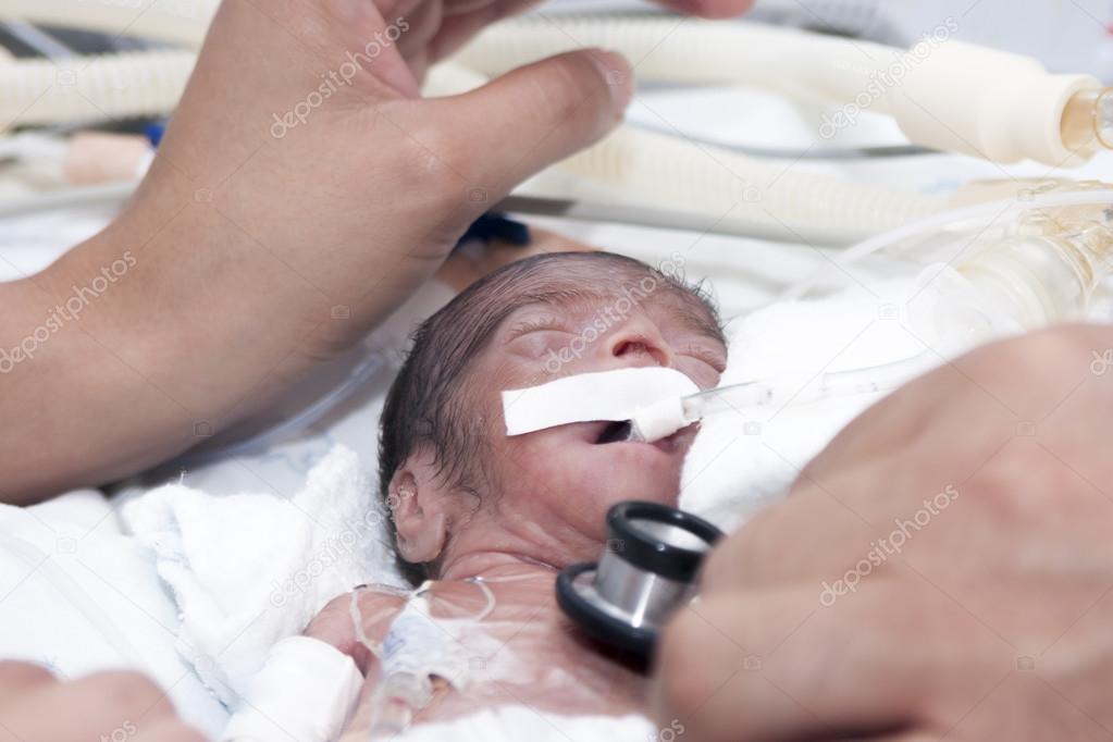 Newborn and hand