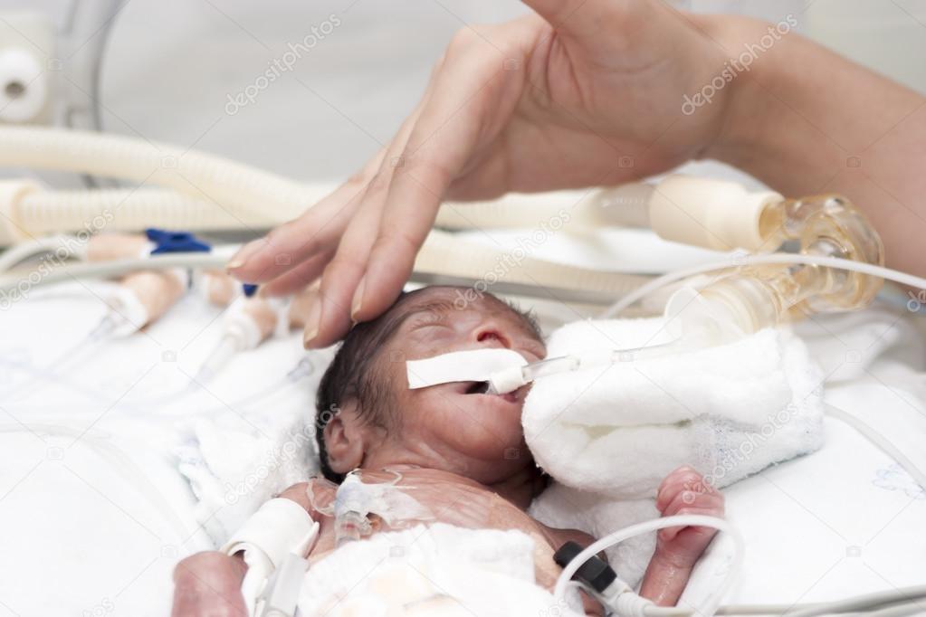 Newborn and hand