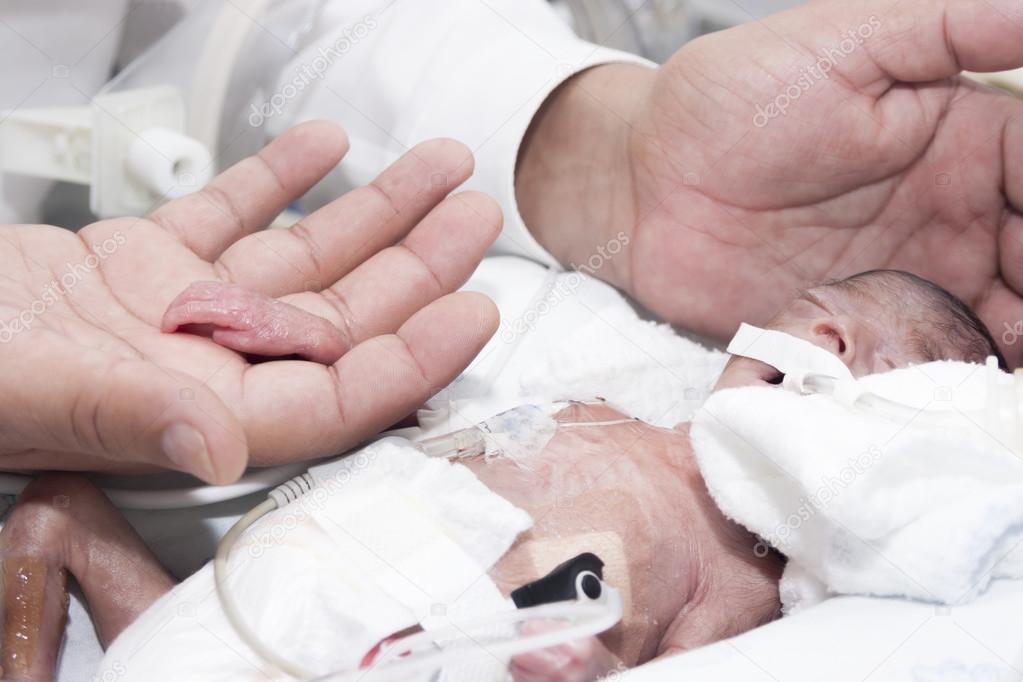 Newborn and hand