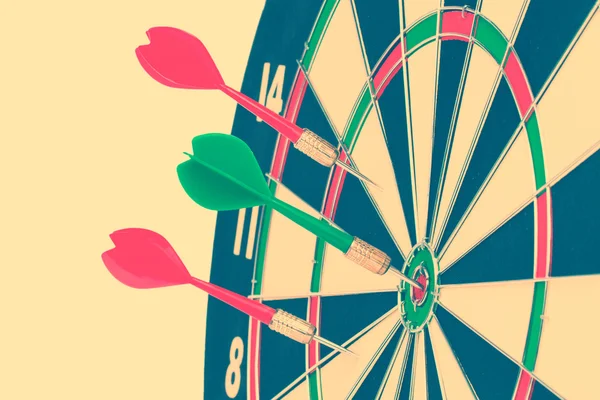 Darts arrows in target center — Stock Photo, Image