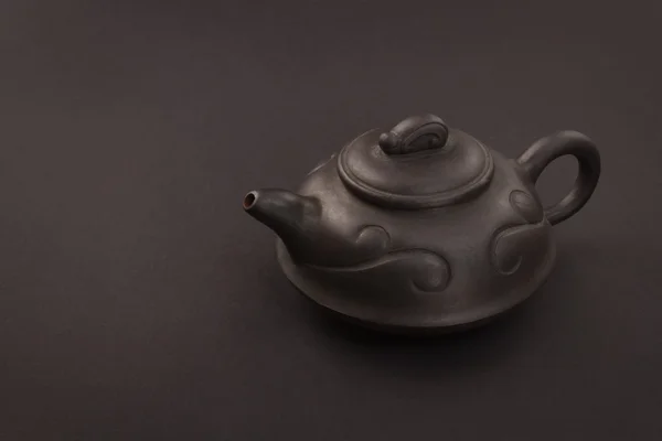 Chinese tea pot on a black — Stock Photo, Image