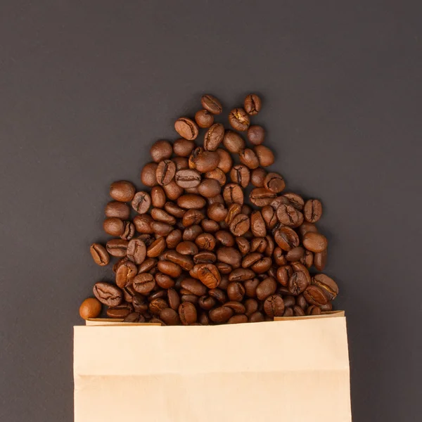 Coffee beans in a paper bag — Stock Photo, Image