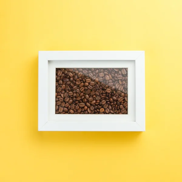 Coffee beans in a photo frame — Stock Photo, Image