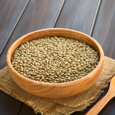 Raw Lentils in Wooden Bowl