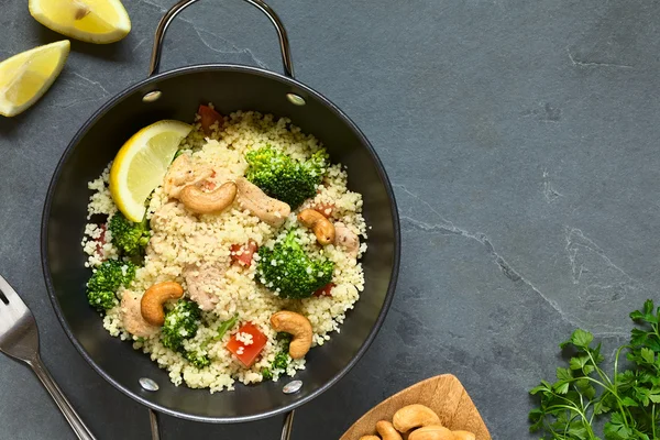 Couscous Dish with Chicken Broccoli Tomato Cashew Nuts — Stock Photo, Image