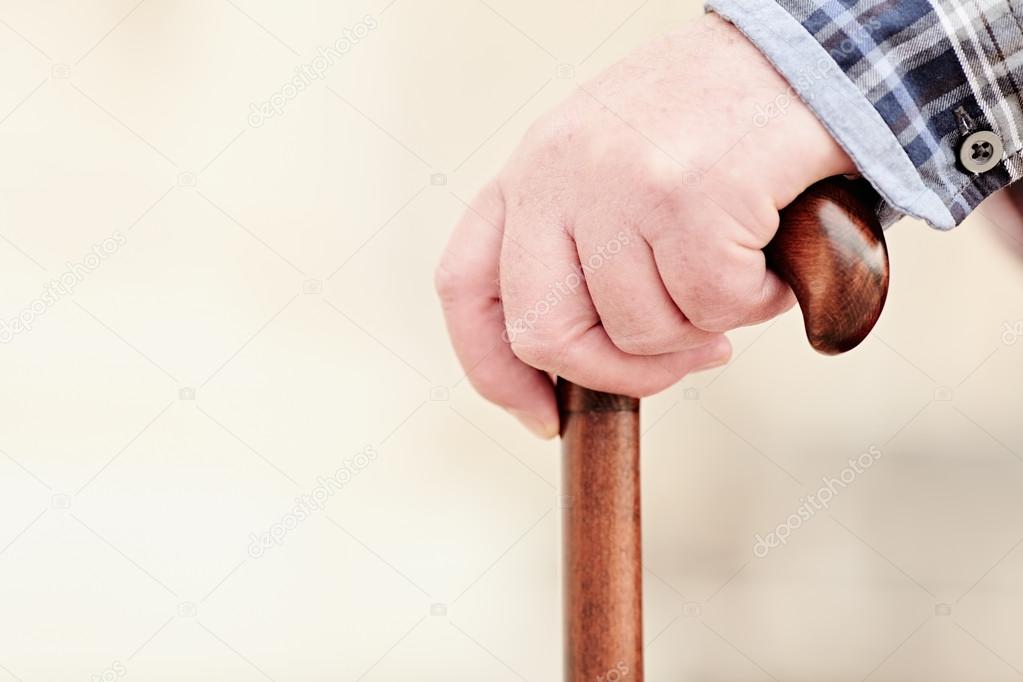 Hand with cane closeup Stock Photo by ©furtaev 100855128