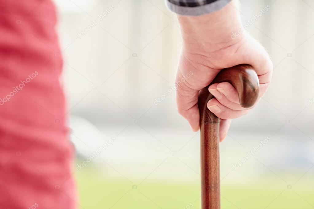 Hand with cane closeup