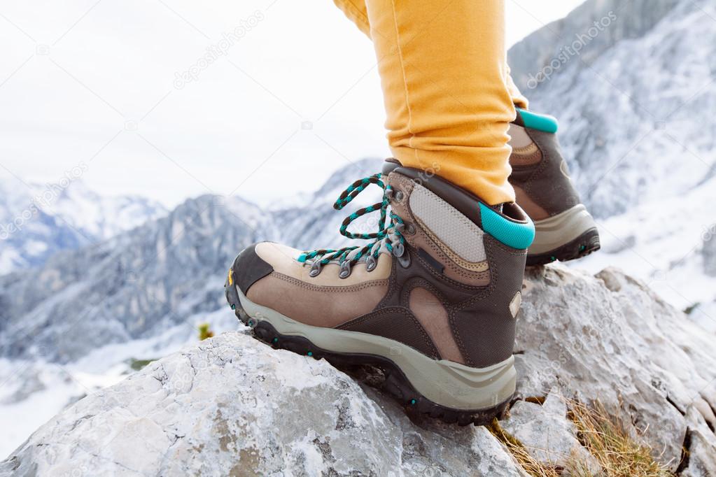 Hiking boots on mountain rocks