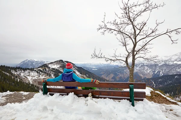 Girl resting on bench on top — Stock Photo, Image