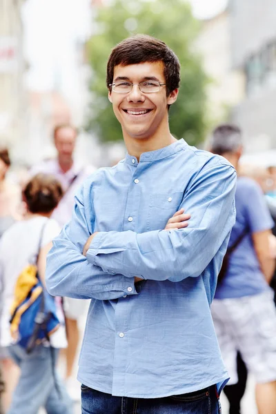 Young man with crossed arms outdoor — Stock Photo, Image