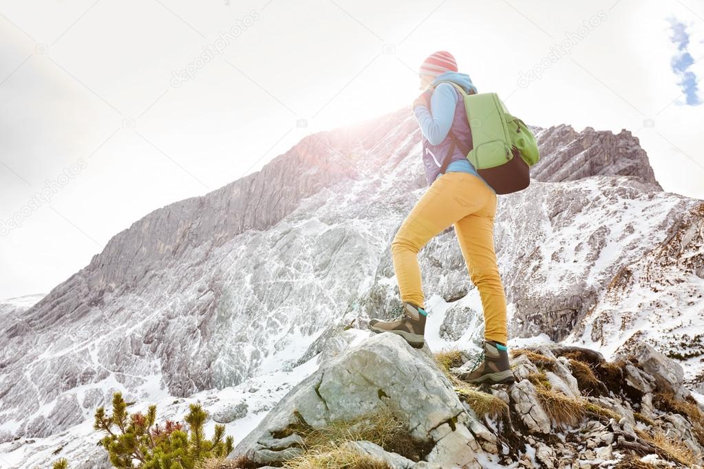 Girl on mountain ledge