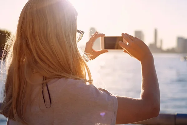 Woman photographing bay closeup — Stock Photo, Image