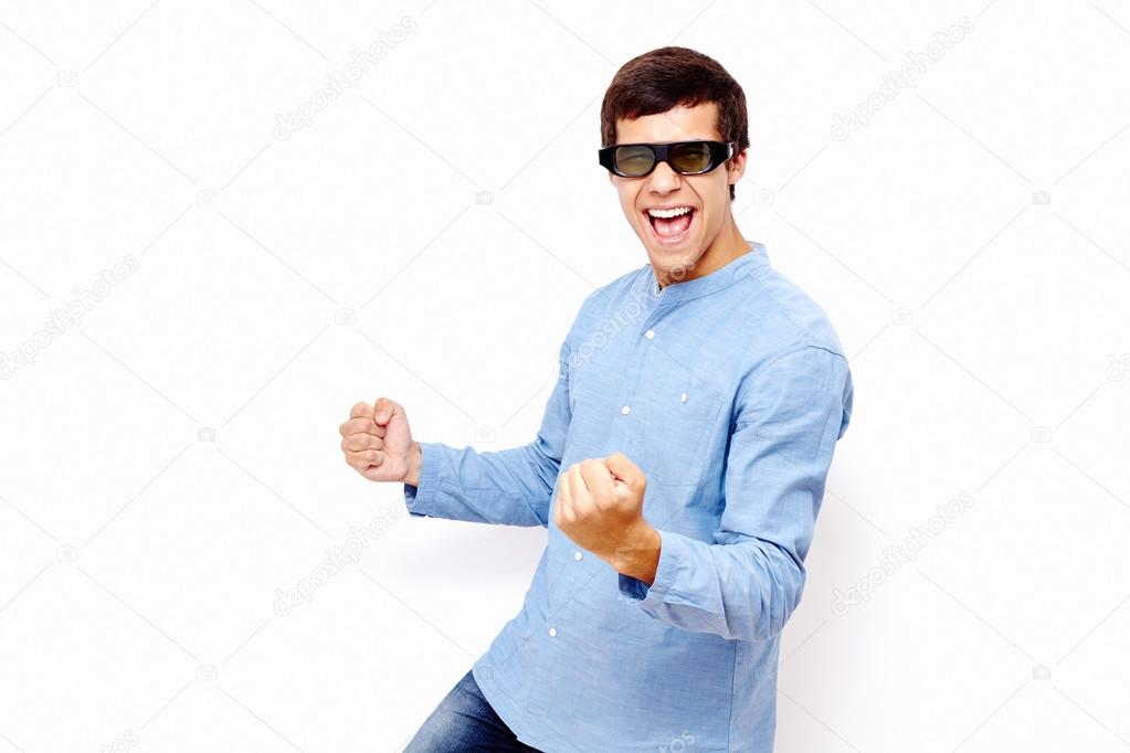 Guy celebrating win in 3D TV glasses