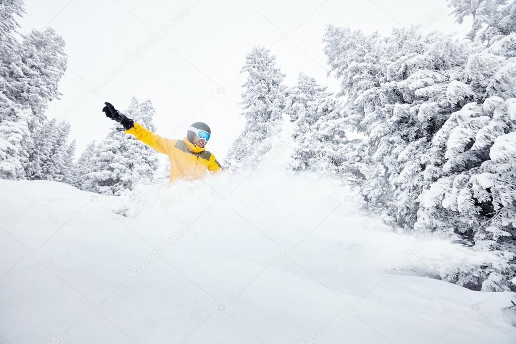Man in backcountry snowboarding