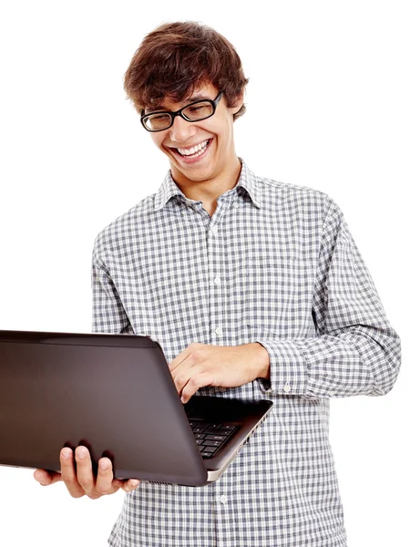 Chico riendo con portátil — Foto de Stock