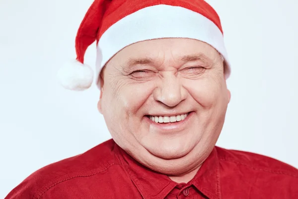 Senior in Santa Claus hat — Stock Photo, Image