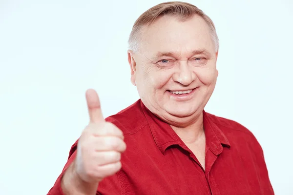 Senior showing thumb up sign — Stock Photo, Image