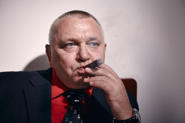 Man with cigar closeup