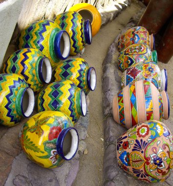 Mexican pottery arranged on ground clipart