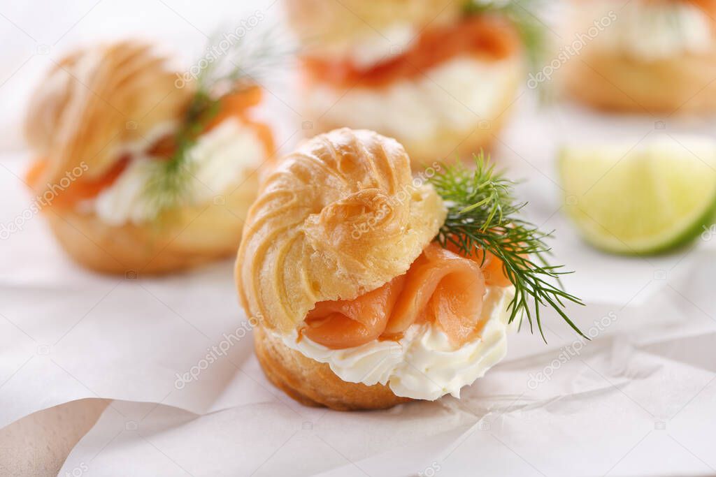 Profiteroles stuffed with cream cheese and salmon.