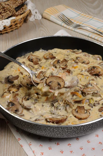 Fried mushrooms in a creamy sauce