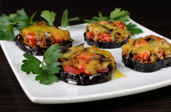 Warm appetizer of eggplant under cheese — Stock Photo, Image