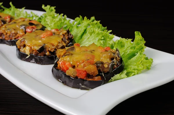 Warm appetizer of eggplant under cheese — Stock Photo, Image