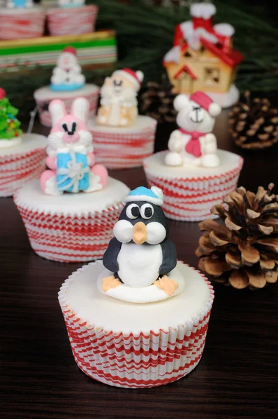 Sugar Christmas penguin figurine on a muffin — Stock Photo, Image